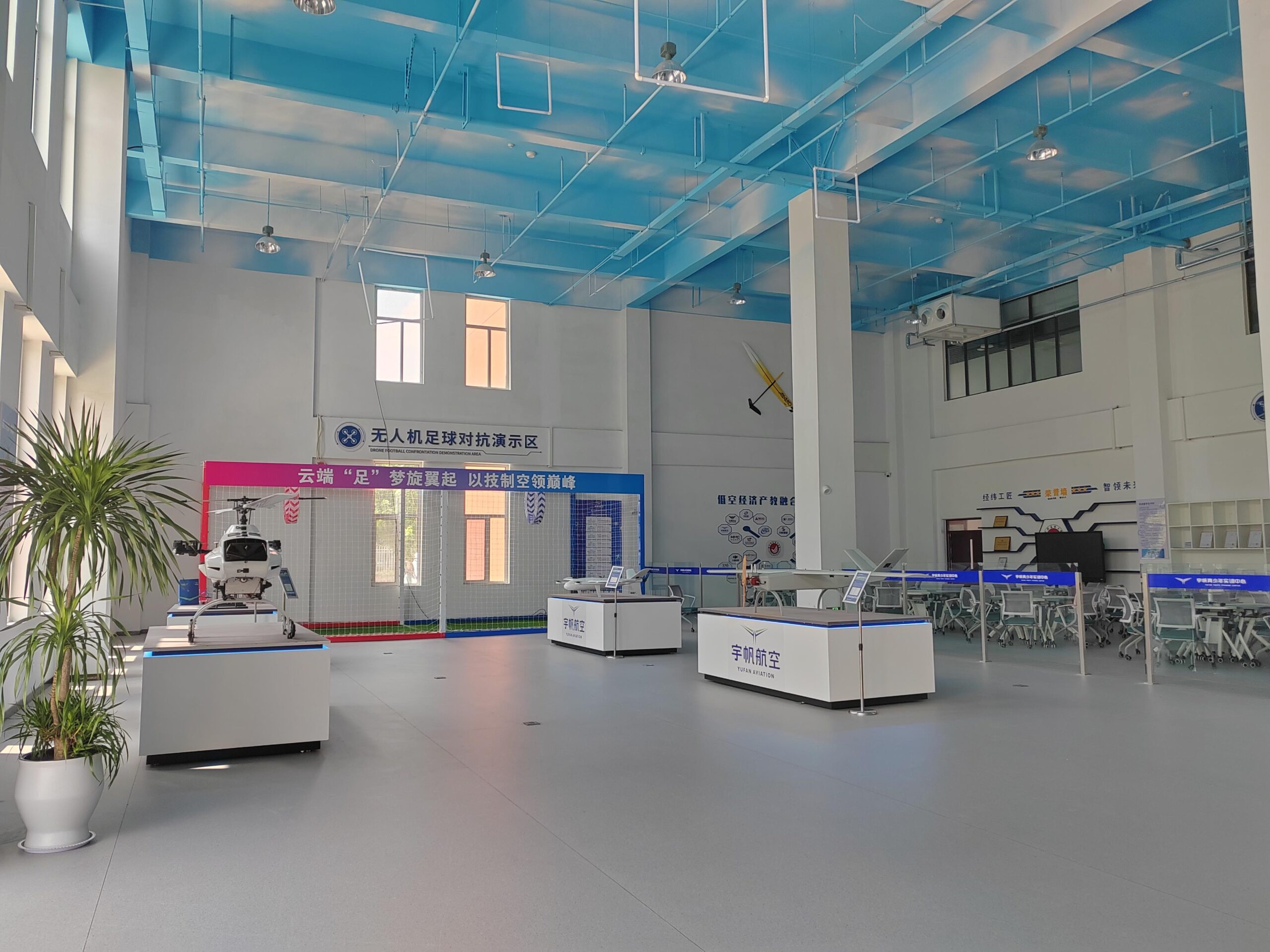 About 100Drone – Your Trusted Source for Drone Parts, Accessories, and DIY Resources 9 Panoramic view of innovation center with drone displays and training area