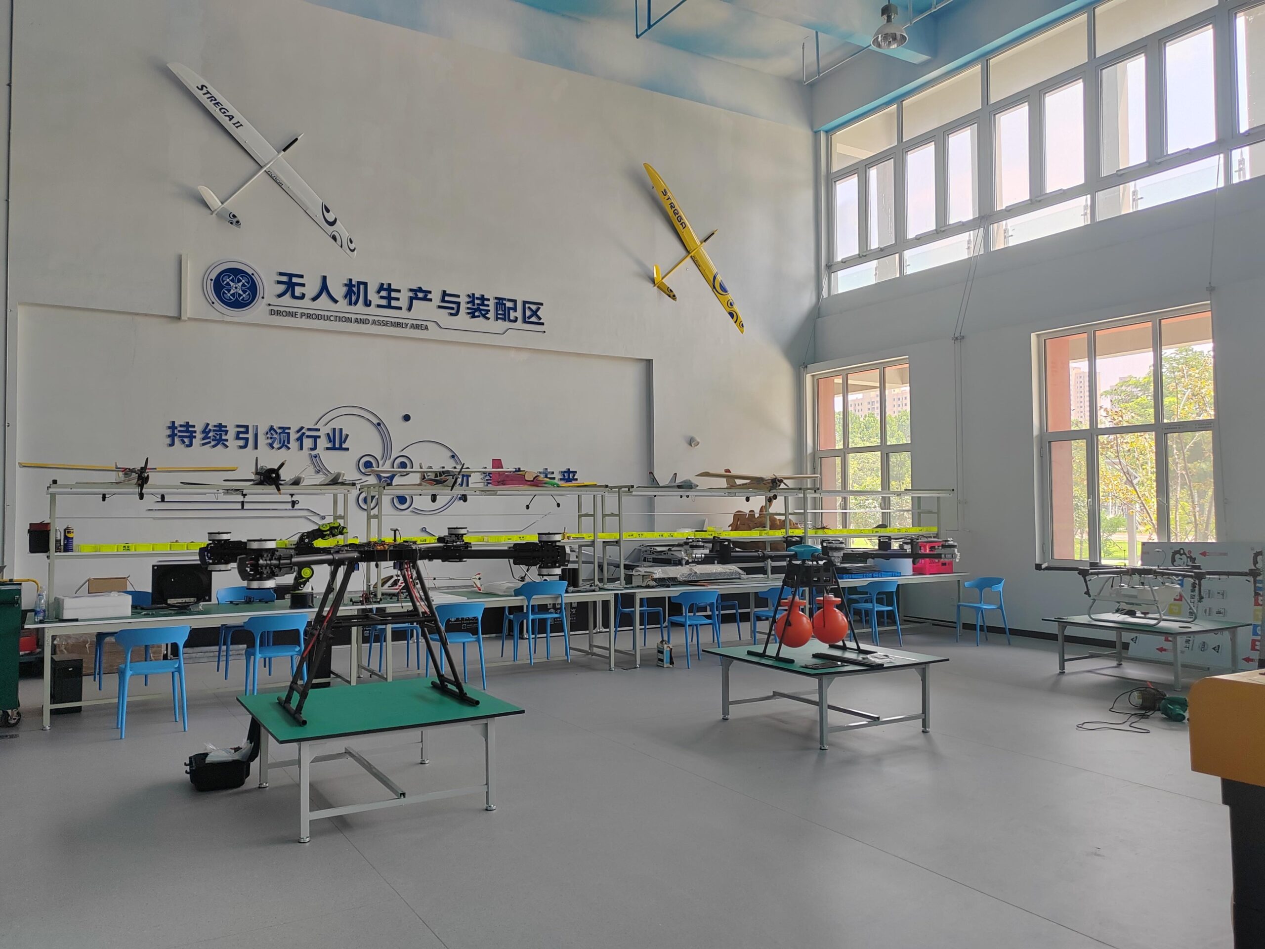 About 100Drone – Your Trusted Source for Drone Parts, Accessories, and DIY Resources 10 Drone assembly workstations with fixed-wing models and multi-rotor frames
