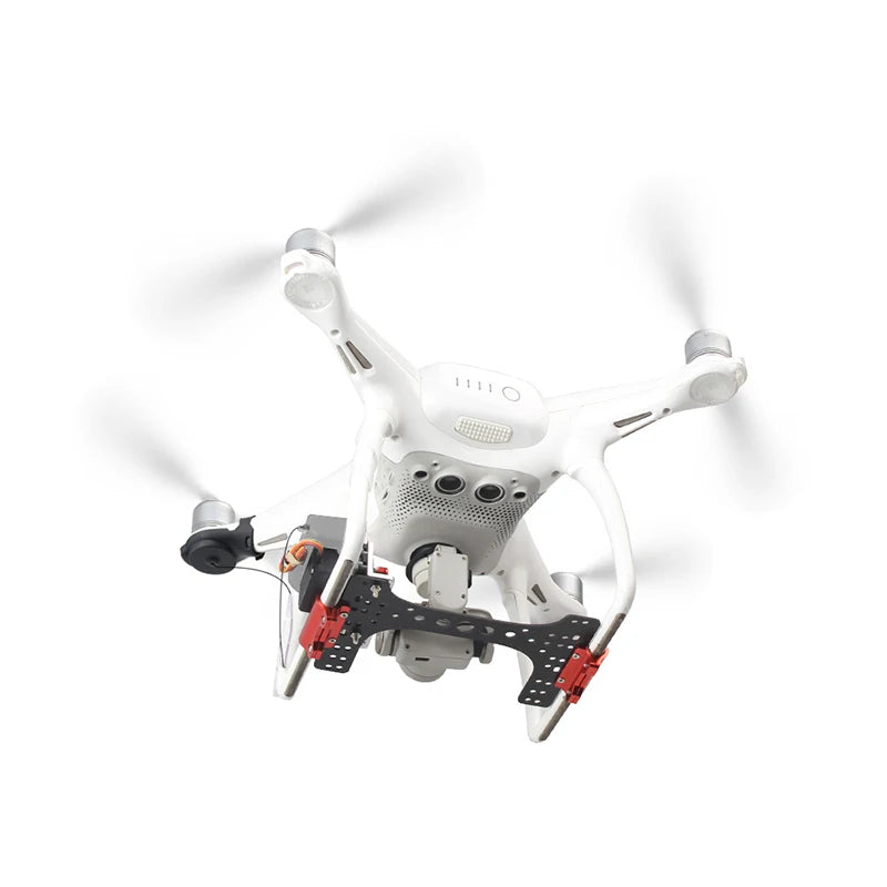 DJI Phantom 4 drone airdrop system with servo switch and remote control for aerial delivery.
